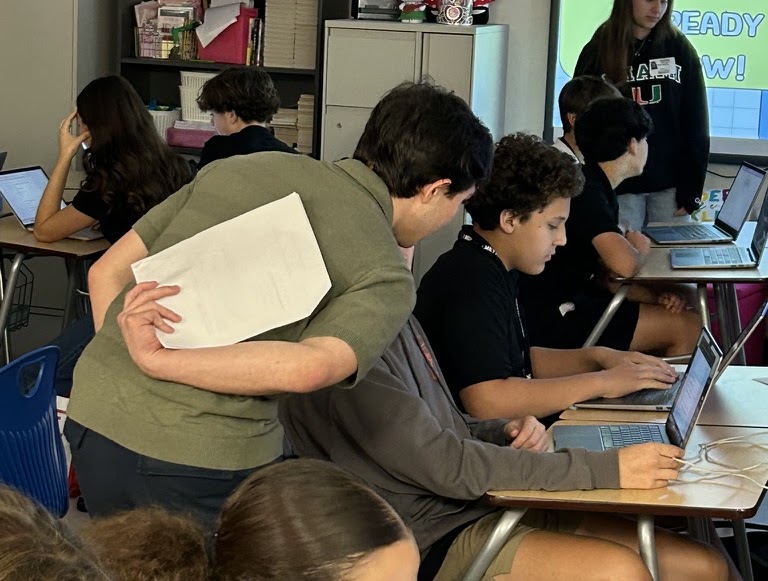 Students working together on a laptop